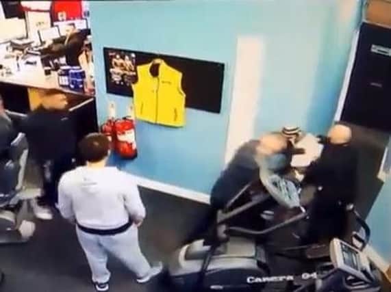 CCTV showing the moment bodybuilders take down suspected bogus caller