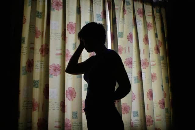 Between 11,000 and 13,000 people are estimated to be caught in modern slavery in the UK (PA - picture posed by a model)