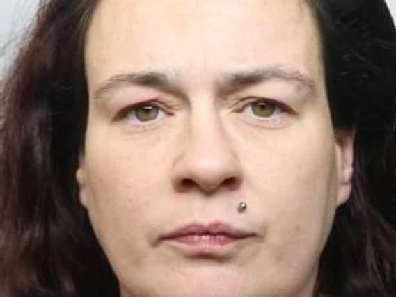 Cheryl Casson, 34, who bit her partner's ear off and threatened police with a knife, following a birthday binge of booze and crack cocaine, has been jailed.