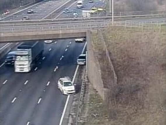 Emergency services are currently on the scene of a two vehicle crash on the M1, that has led to the closure of one lane.