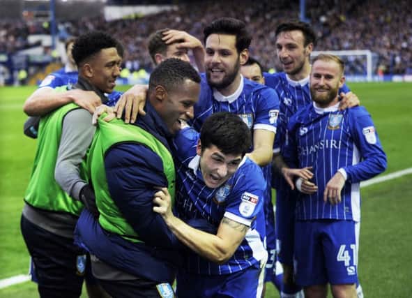 Fernando Forestieri celebrates his  goal with Jose Semedo and the rest of his Sheffield Wednesday team mates...Pic Steve Ellis