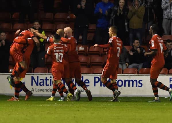 Walsall's players celebrate Scott Laird's goal.