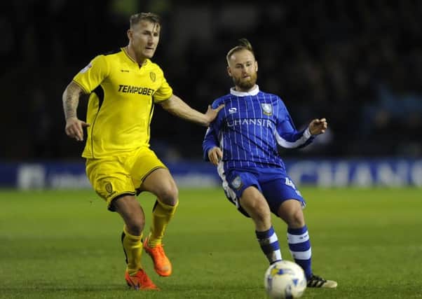Sheffield Wednesday midfielder Barry Bannan comes up against his old club