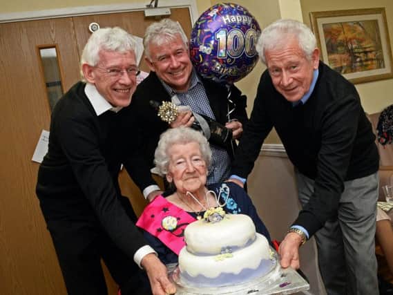 Ada Needham, pictured with her three sons, Philip, Barry and Frank, celebrating her 100th birthday at Richmond Heights Nursing Home. Picture: Marie Caley