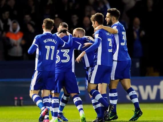 Owls players celebrates Ross Wallace's goal against Burton