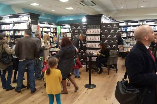 Jessica Ennis-Hill signing books.