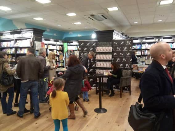 Jessica Ennis-Hill signing books.