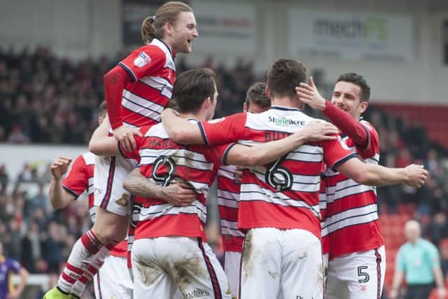 Rovers' players celebrate Andy Butler's opening goal.