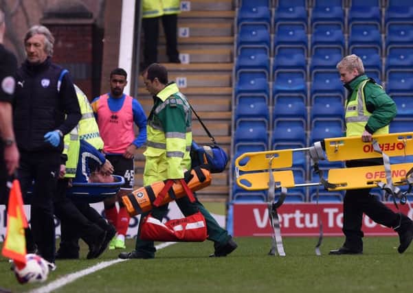 Picture Andrew Roe/AHPIX LTD. Chesterfield's Ian Evatt is stretchered off the pitch.