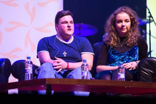 CAFOD young leaders Ryan Wilkinson, from Sheffield, and Leah Fox, from Newscastle speaking onstage about meeting refugees at the Flame 2017 event held at London's Wembley Stadium (credit_Thom Flint,CAFOD)