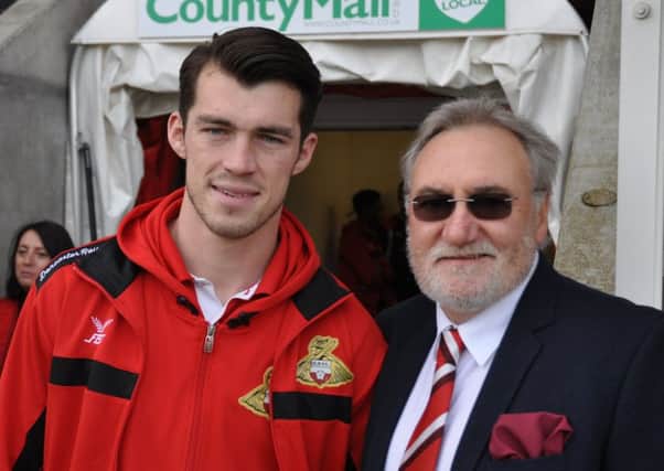 Doncaster Rovers striker John Marquis alongside former striker Peter Kitchen