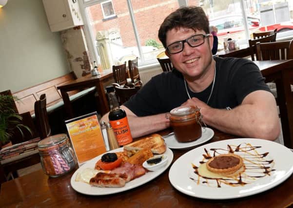 Spoon Owner Jules Evans pictured with an All day Breakfast and a homemade Chocolate and Orange Tart, served with Pear and Apple Puree. Picture: Marie Caley NSST Spoon MC 1