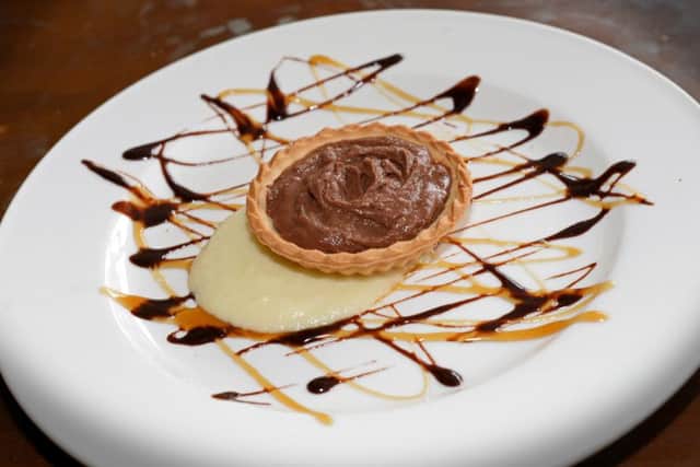 Chocolate and Orange Tart, served with a Pear and Apple puree, one of the many homemade desserts available at Spoon Cafe and Bistro.Picture: Marie Caley NSST Spoon MC 5