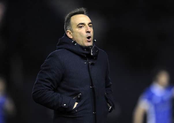Carlos Carvalhal cuts a frustrated figure after his side's defeat to Reading at Hillsborough