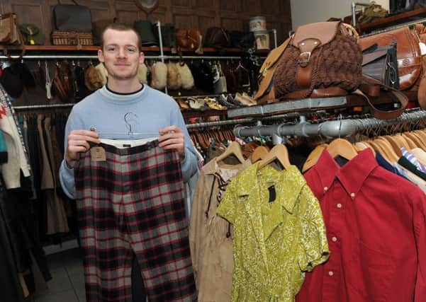 Tristan Brokenshire, of Mooch Vintage, Division Street, with some of the shops stock.