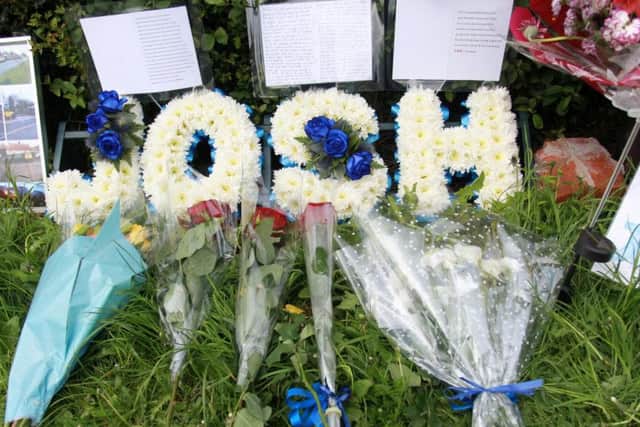 Tributes left to Josh on Mansfield Road, Swallownest