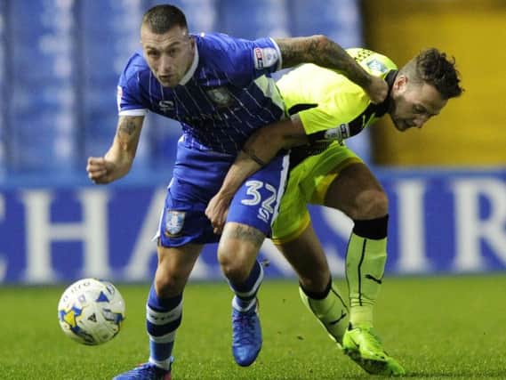 Jack Hunt holds off Reading's Danny Williams
