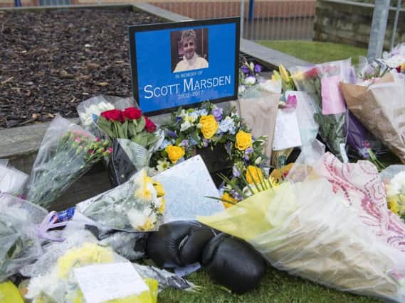 Floral tributes outside Forge Valley School - picture by Dean Atkins