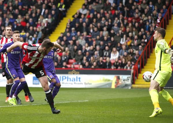 Jack O'Connell heads home. Pictures: Sport Image