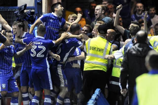 Wednesday players and fans celebrate Kieran Lee's injury time winner against Bristol City earlier this season