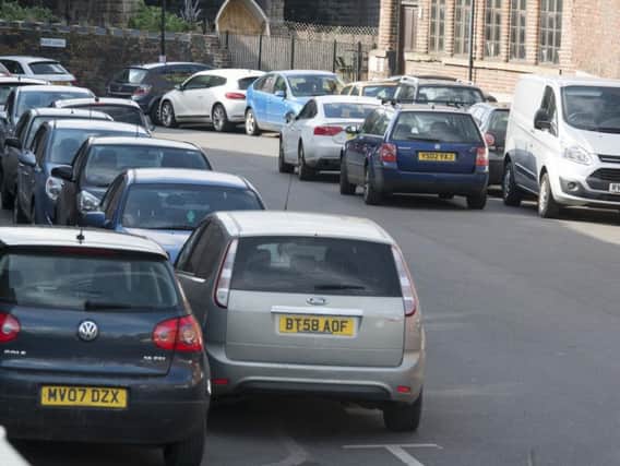 Cars parked on Blast Lane where double yellow lines will force commuters to park elsewhere