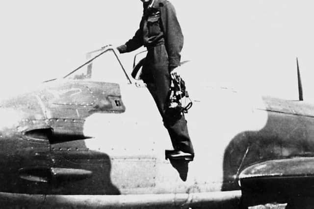 Dennis Barry with one of the Gloster Meteor fighter jets which he flew during the Second World War (Graham Pitchfork)