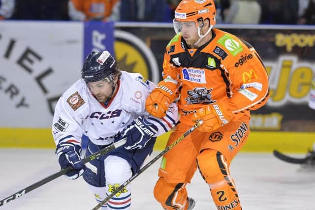 Anders Franzon, Sheffield Steelers defenceman holds off a Dundee challenger