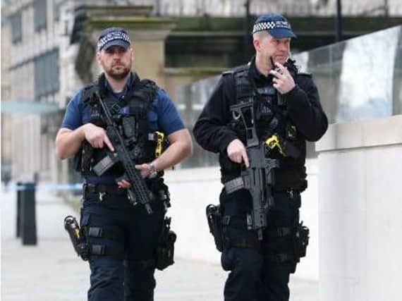 Armed police in London (PA)