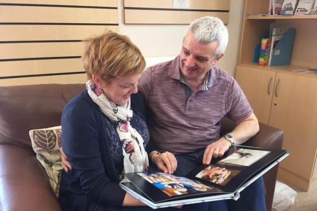 The couple showed off their wedding album to staff at Weston Park Cancer Support Centre