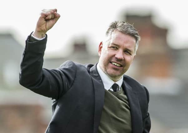 Darren Ferguson salutes the Rovers fans at Grimsby