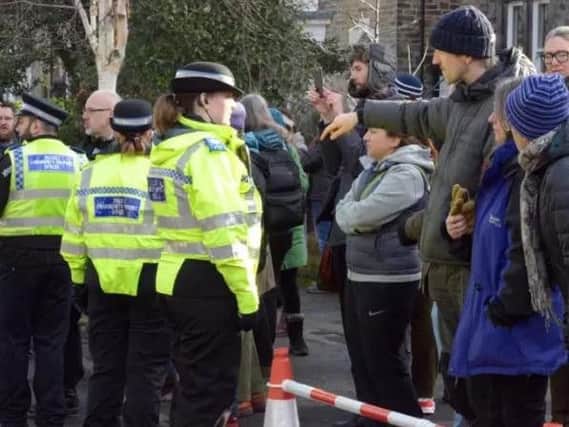 Tense scenes between tree felling protesters and police.
