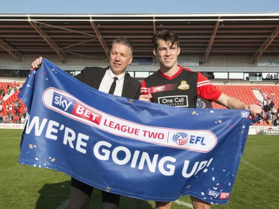 Darren Ferguson and John Marquis celebrate promotion to League One