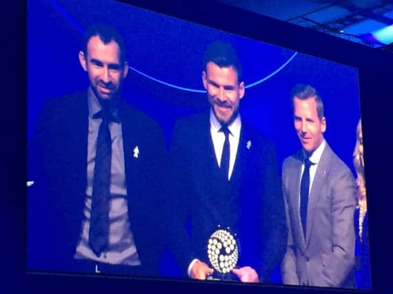 Andy Butler receives his PFA Community Player of the Year award