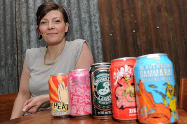 Sarah Ingolfsdottir, of Hagglers Corner Bar, with a selection of craft ale they sell.