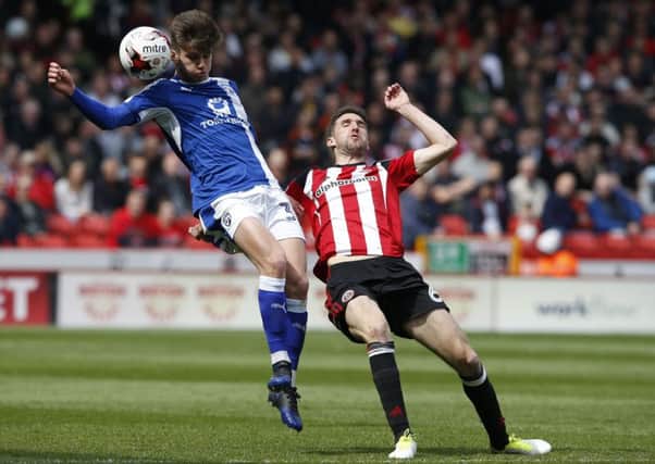 Joe Rowley of Chesterfield in action with Chris Basham of Sheffield Utd during the English League One match at  Bramall Lane Stadium, Sheffield. Picture date: April 30th 2017. Pic credit should read: Simon Bellis/Sportimage