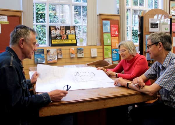 Kane Yeardley, Veronica Hardstaff and Chris Reece looking at the plans for Walkley Carnegie Library