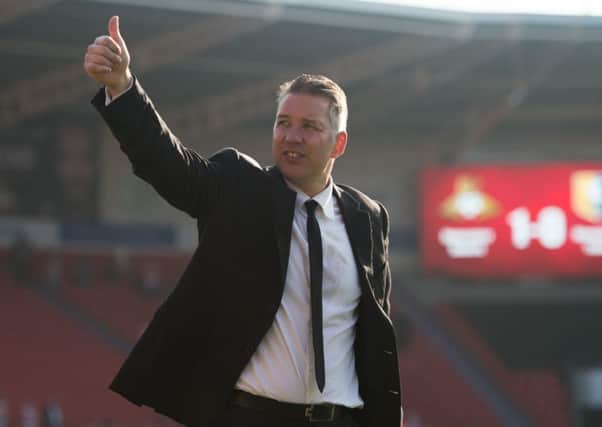 Doncaster Rovers Manager Darren Ferguson celebrates promotion after the Mansfield match. Photo: Jon Buckle/PA