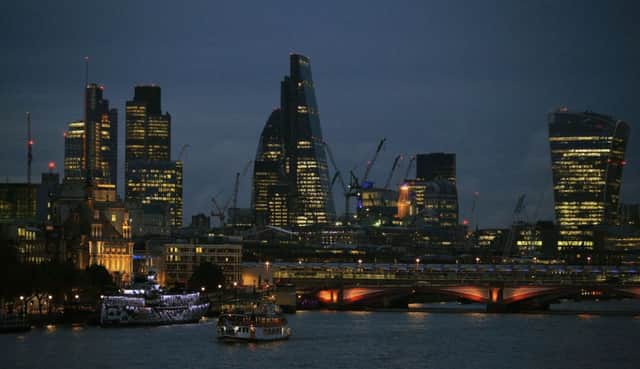 The City of London skyline at dusk, with Blackfriars Bridge in the foreground  Photo:  Jonathan Brady/PA Wire