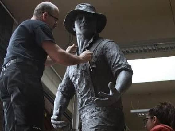 The memorial statue being built