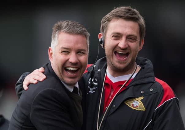 Darren Ferguson and Gavin Strachan celebrate the recent win at Grimsby.