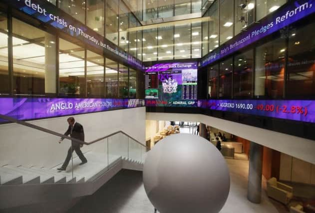 A view of the information screens at the London Stock Exchange. Bovis has issued a trading update today. Photo: Yui Mok/PA Wire