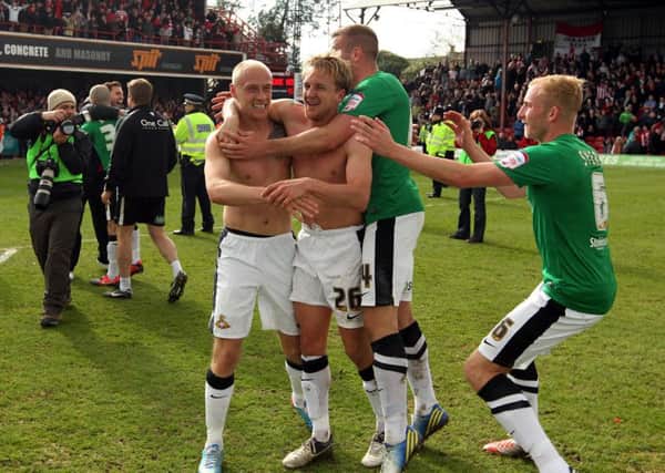 James Coppinger celebrates winning the League One title in dramatic fashion in 2013.