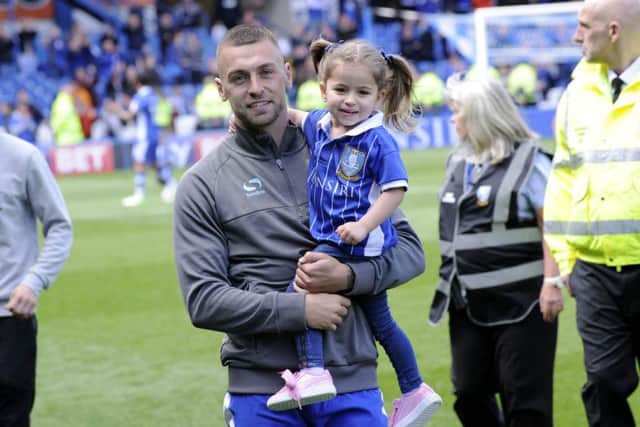 Jack Hunt with his daughter at the end of regular season game against Fulham.....Pic Steve Ellis