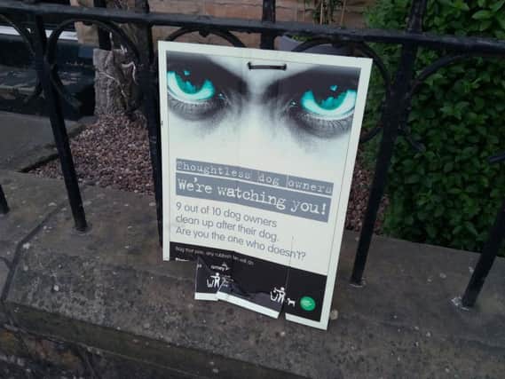 A poster in Parsonage Crescent, Walkley, warning dog owners they're being watched