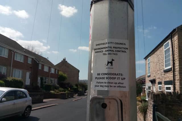 A warning sign on a lamppost in Walkley
