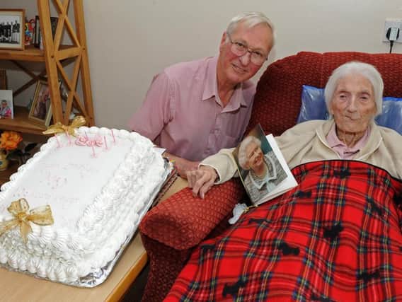 John and May Lashmar with the birthday cake.
