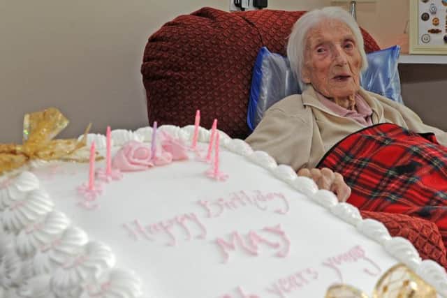 May Lashmar with her cake.