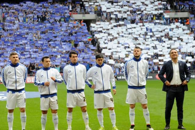 A proud Carlos Carvalhal stands alongside his players before last season's Play-Off Final at Wembley