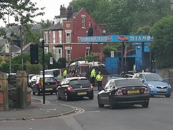 Police at the scene of the attack in Burngreave Road this morning. Pic: Sinnitte Swietee