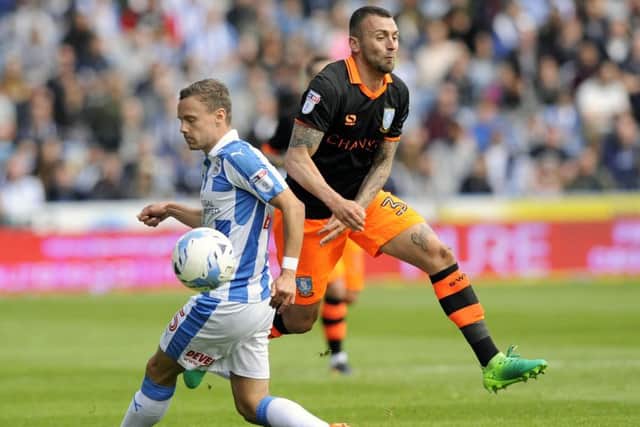 Jack Hunt wins the ball in yesterday's semi-final against Huddersfield at the John Smith's Stadium